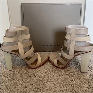 BCBGMAXAZRIA two-tone leather cage sandal with embossed lizard straps.